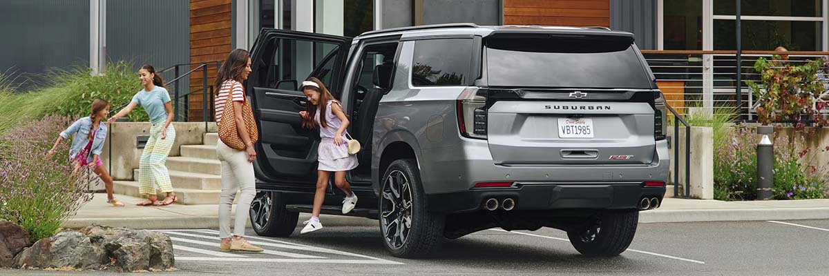 family getting out of a suburban