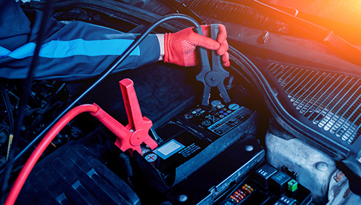 Jumper cables placed on a battery in a 2023 Honda Pilot.
