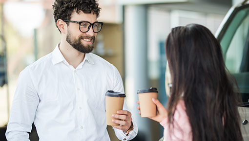 Customers with cups of coffee